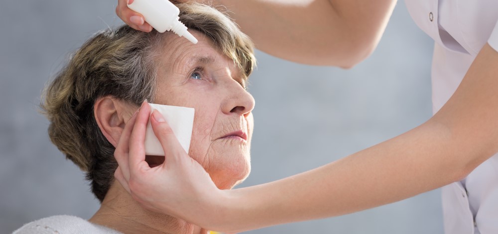 Elderly patient receiving eye drops after a successful glaucoma surgery in the Philippines