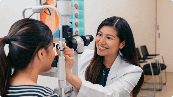 an ophthalmologist seeing a patient