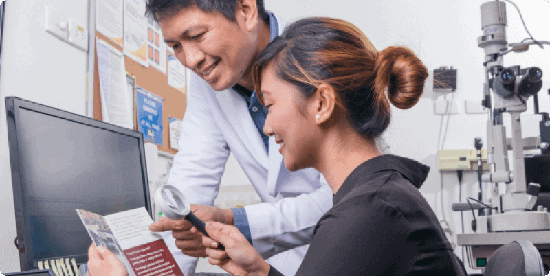 an ophthalmologist seeing a patient