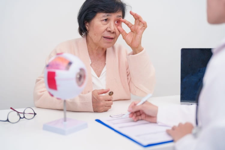 an elderly woman having a check up with an eye doctor